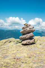 Stone balance (or stacking rocks)  at the top of a mountain in Italy. Zen concept.