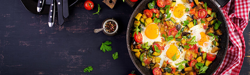 Late breakfast - fried eggs with vegetables. Shakshuka. Arabic cuisine. Kosher food. Banner. Top...