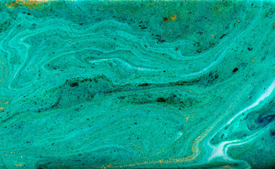 Green and gold marbling pattern. Golden powder marble liquid texture.