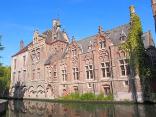 Fototapeta na wymiar Bruges cityscape with water canal and bridge, Flanders, Belgium