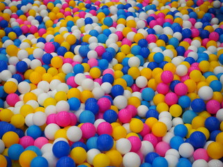 Fototapeta na wymiar Colorful child balls. Multi-colored plastic balls. children's playroom. Background texture of multi-colored plastic balls on playground