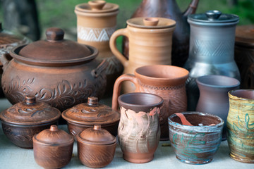 Fototapeta na wymiar pottery of various shapes and accessories for liquid pouring