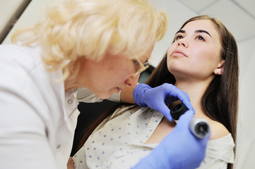 Doctor examining birthmarks and moles patient. examination of birthmarks and moles.the doctor...