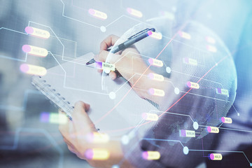 Multi exposure of hands making notes with world map hologram and data theme icons. Concept of global data.