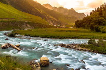 Water flowing at Hill station of Sonamarg, Jammu and Kashmir. Valley of flowers, aqua marine rivers and streams , turquoise, landscape, nature, Himalayas, snow mountains. Serene peaceful mother nature
