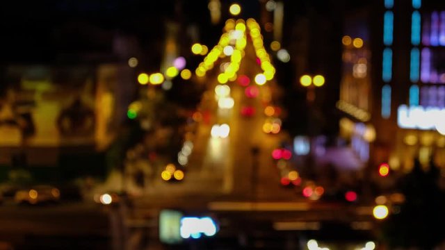 Defocused night city car traffic lights. Color blurred bokeh of moving transport and typical city view