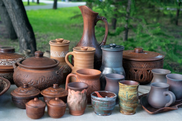 Fototapeta na wymiar pottery of various shapes and accessories for liquid pouring