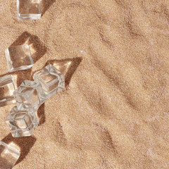 Summer day scene with ice cubes and shadows on sand background. Minimal sunlight tropical flat lay arrangement.
