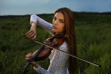 Girl with violin in the forest © mizinra