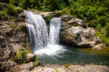 Fototapeta premium Sister Waterfall Landscape, nature of the southern part of Hainan Province, China