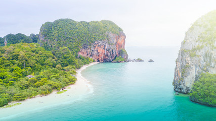 Aerial view of Phranag Beach, Railay Bay in Krabi Thailand with the spectacular mountain and white beach along the emerald water