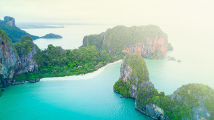 Aerial view of Phranag Beach, Railay Bay in Krabi Thailand with the spectacular mountain and white beach along the emerald water and island