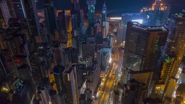 night illuminated flight over hong kong city downtown traffic aerial panorama 4k timelapse 