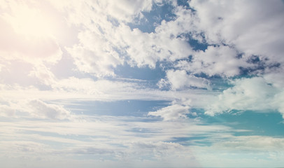 Blue sky clouds background. Beautiful landscape with clouds and sun