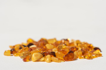 yellow amber stones on white background