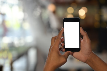 Man's hands holding smartphone with empty screen.
