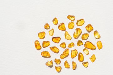 yellow amber stones on white background