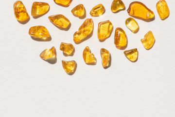 yellow amber stones on white background