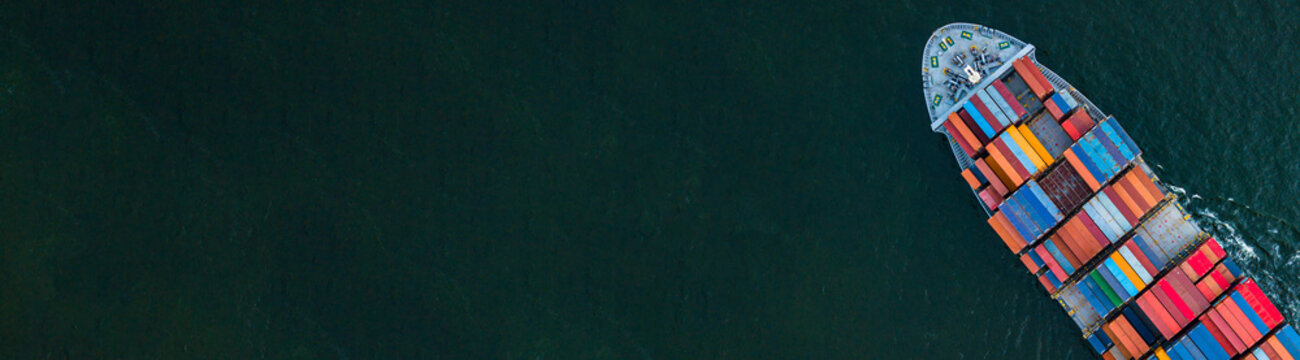 Container ship carrying container for import and export, business logistic and transportation by container ship in open sea, Aerial view container ship with copy space for design banner web