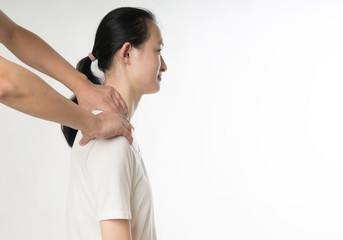 Fototapeta na wymiar Professional female physiotherapist giving shoulder massage to man in hospital