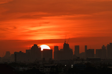 Cityscape with  building silhouette,sunset at evening  in Bangkok ,Thailand