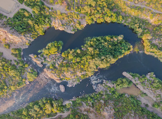 From above view of river with island. Landscape aerial top view.