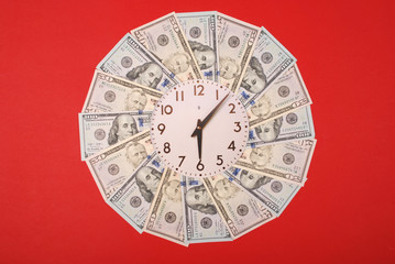 Concept of clock and dollar. Clock on mandala kaleidoscope from money. Abstract money background...