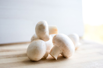 fresh mushrooms on a cutting board