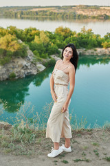 Family travel on vacation near lake in summer. Tourist enjoying on vacation. Relax on lake. Summer vacation.  Camping, picnic near lake.Romantic date on background of landscape.Woman on lake