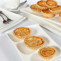 mushroom quiche- is a French tart consisting of pastry crust filled with savoury custard and pieces of cheese, meat, seafood or vegetables.
