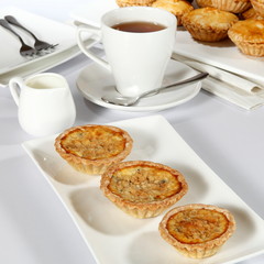 mushroom quiche- is a French tart consisting of pastry crust filled with savoury custard and pieces of cheese, meat, seafood or vegetables.