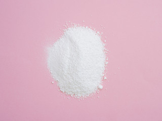 Flat-lay detergent powder on colorful background