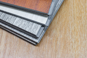 PVC Polymer Vinyl sample for customers to choose the floor design within the copy space .