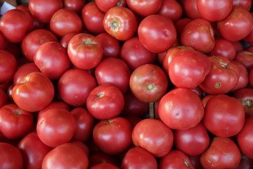 Pile organic fresh red tomatoes on the market. Isolated. Ingredient. Healthy food. Top view. Flat lay. 