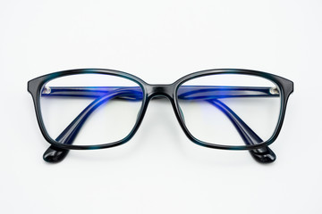 Black eye glasses spectacles with shiny black frame For reading daily life To a person with visual impairment. White background as background health concept with copy space.