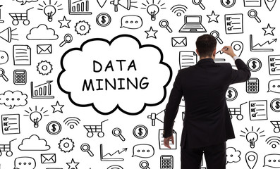 Business, technology, internet and networking concept. Young entrepreneur showing keyword: Data mining