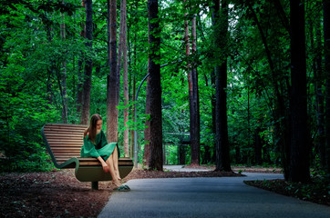 Beautiful young woman resting in the park