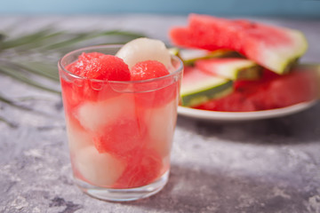 Fruit salad with melon and watermelon balls in glass