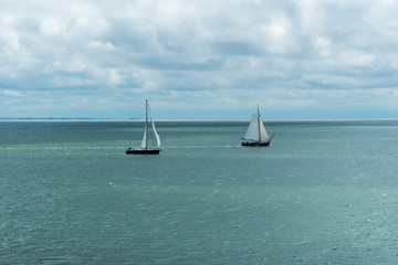 Fototapeta premium Two sailing boats in the Wadden Sea. The Netherlands, Europe.