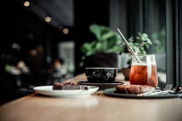 Coffee and bakery beverage on wooden table , coffee shop background
