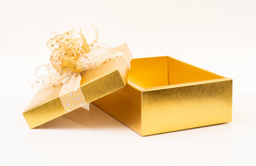 Gold gift box on white background