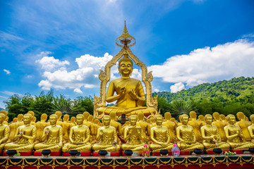 Big golden Buddha statue among small 1,250 Buddha statue at Makha Bucha Buddhist memorial park built on the occasion of Great period, Buddha 2600 years at nakhon nayok province, Thailand