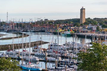 Brandaris lighthouse behind sailboats and plaisure yachts. Terschelling, The Netherlands, Europe.