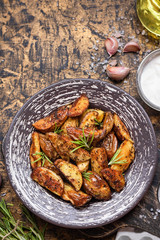 Baked young potatoes in a rustic style with sour cream