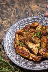 Baked young potatoes in a rustic style with sour cream