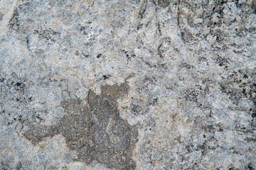 White natural chalk rock wall. Grunge gray and white background texture, close up