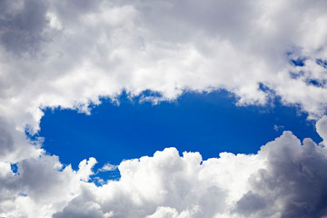 In the sky with white clouds.