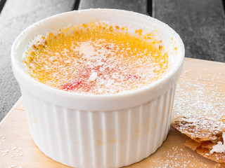 Creme brulle desert in a white bowl