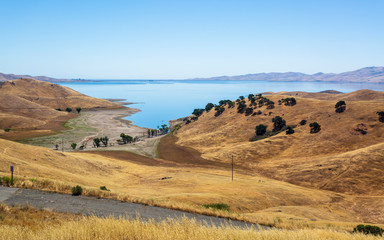 Driving through the golden hills of California; the San Luis Reservoir State Recreation area