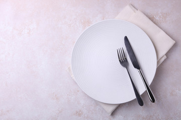 plate and cutlery on napkin
